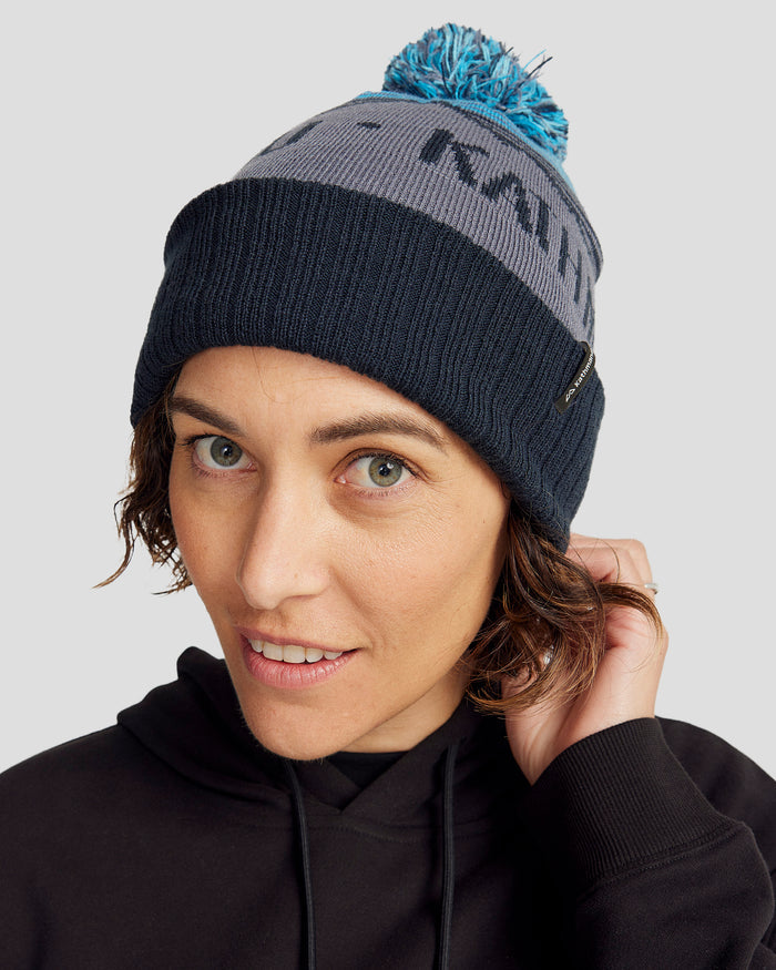 b0618_oqv_mtn_skies_pompom_beanie_blue_b_1743628839000