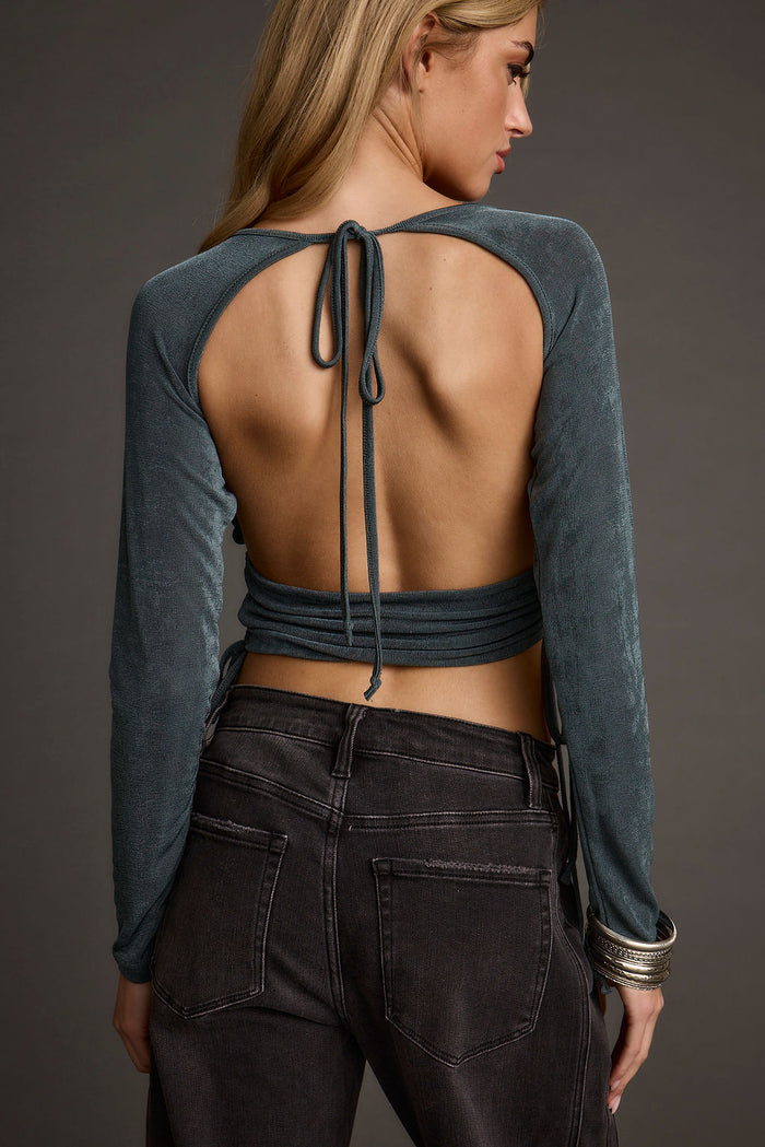 Emerald crop top with elegant accents, a sequin crop top essential.