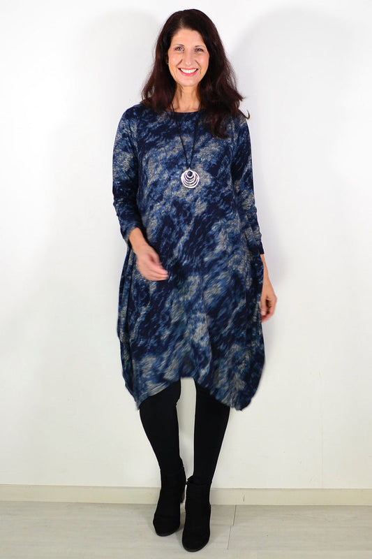 Peony Nova navy abstract tunic dress displayed on a hanger, featuring a flowing design and artistic navy and white pattern.