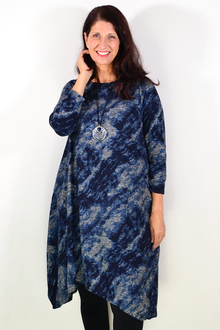 Peony Nova navy abstract tunic dress featuring a relaxed fit and artistic print, displayed on a hanger.