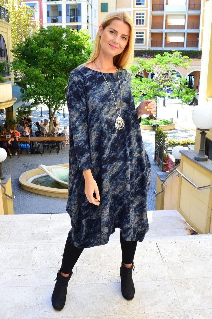 Peony Nova Navy abstract tunic dress featuring a loose fit and vibrant blue color, displayed on a mannequin.