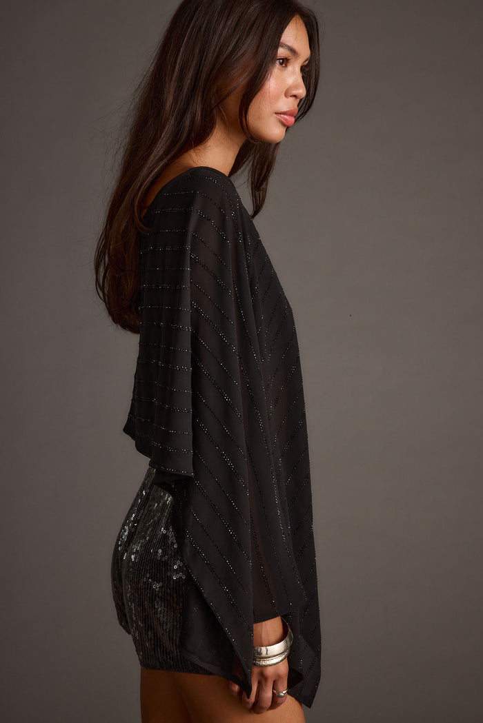 Detail shot of the Oasis Black Rhinestone Shawl highlighting the rhinestone elements.