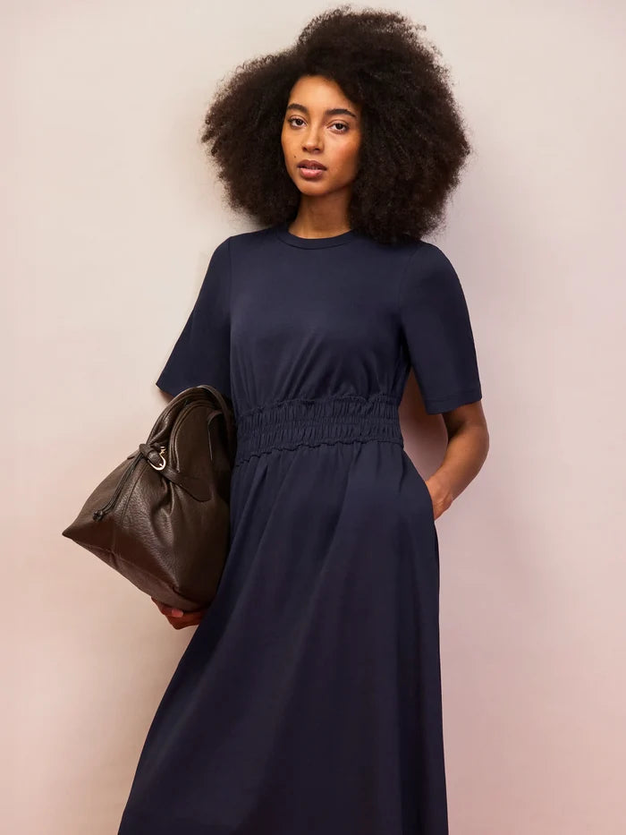 Women’s navy elasticated waist dress with crew neckline and flowing skirt