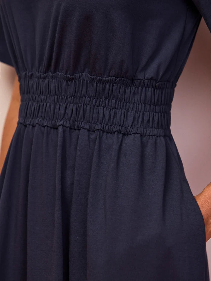 Navy short sleeve midi dress featuring a cinched elasticated waist