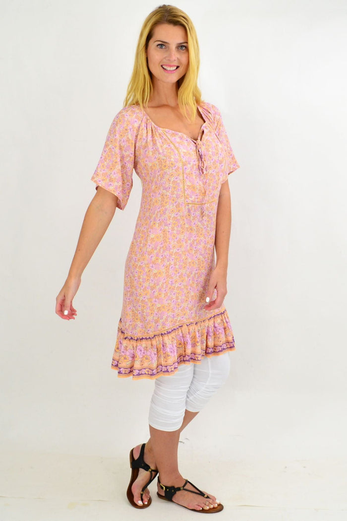 Baby pink floral tunic top by New U Collection, featuring flowy fabric and a relaxed summer style.