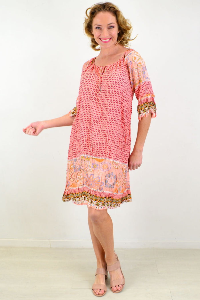 Pink starfish crinkle tunic dress from Hourglass, featuring a flowy, textured fabric with a relaxed fit and vibrant starfish pattern.