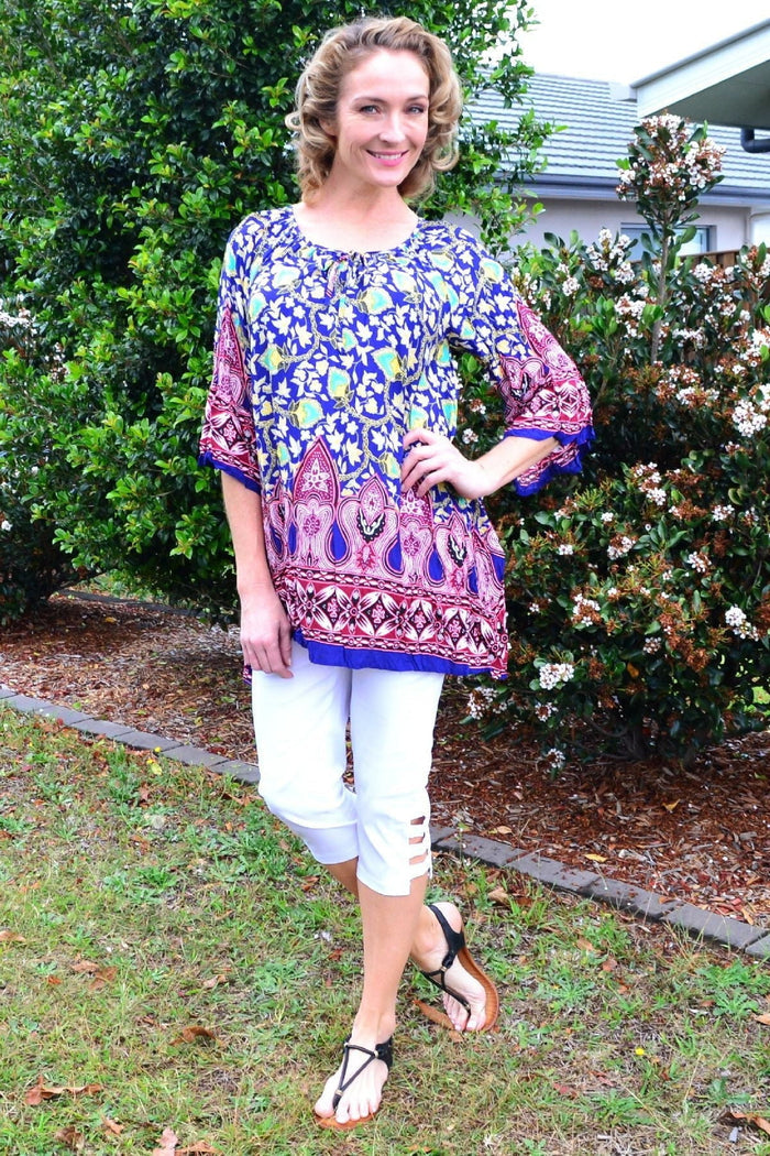 Hourglass Rajasthani Palace Crinkle Tunic Top with intricate patterns and flowing fabric, displayed on a mannequin.