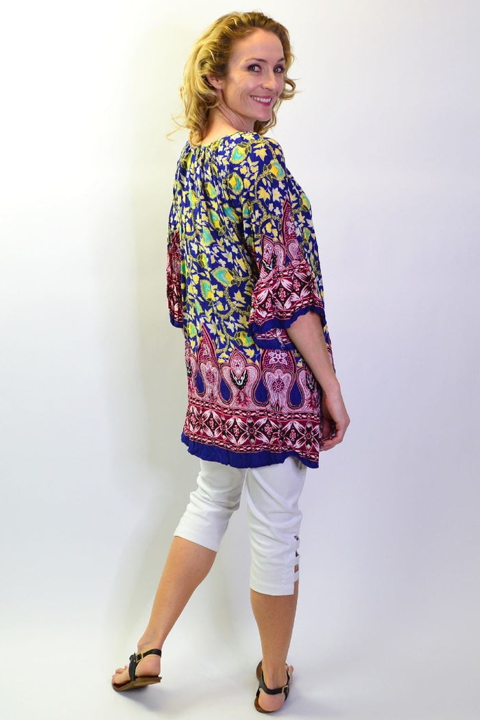 Rajasthani Palace Crinkle Tunic Top by Hourglass featuring intricate patterns and flowing fabric, displayed on a mannequin.