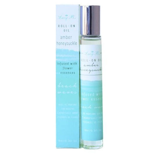 Roll-on Oil - Beach Waves Amber & Honeysuckle | Hydra Bloom in a clear glass bottle with silver cap alongside its blue and white packaging, promoting skincare and wellness with floral essences.