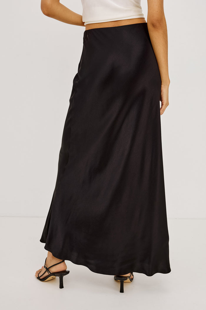 Romina Midi Skirt in Satin Back Crepe With Bias Cut in Ginger Spotted Colorway - Lower Body Back View Featured on Model