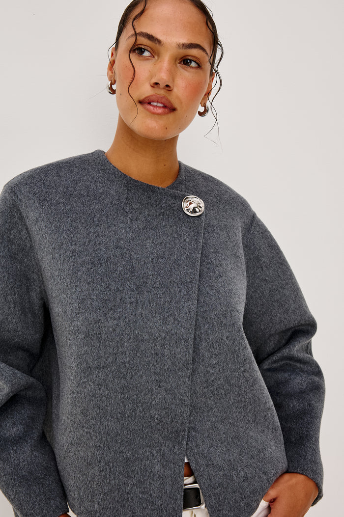 Ronda Jacket in Heavy Wool Blend With Boxy Wrap Style Design, Front Molded Metallic Button Closure, Long Sleeves, and is Unlined in Heater Charcoal Colorway - Upper Body Front View Featured on Model