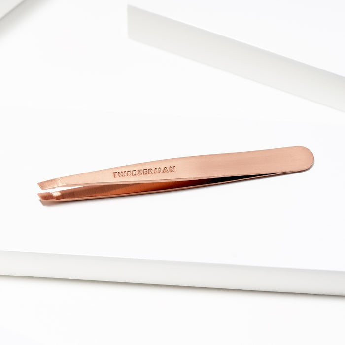 Rose Gold Slant Tweezer | Tweezerman with a sleek, durable metal design ideal for precise eyebrow shaping and grooming in skincare routines.