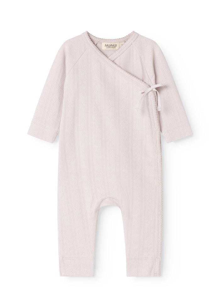 Light purple dress with long sleeves and a cord detail at the neckline.