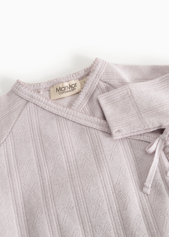 Light purple dress with collar, detailed stitching, and visible care label.