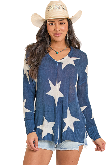Woman in star sweater and cowboy hat
