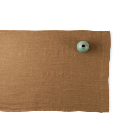 R+D.LAB tela runner in warm brown linen with heath ceramics bud vase in juniper