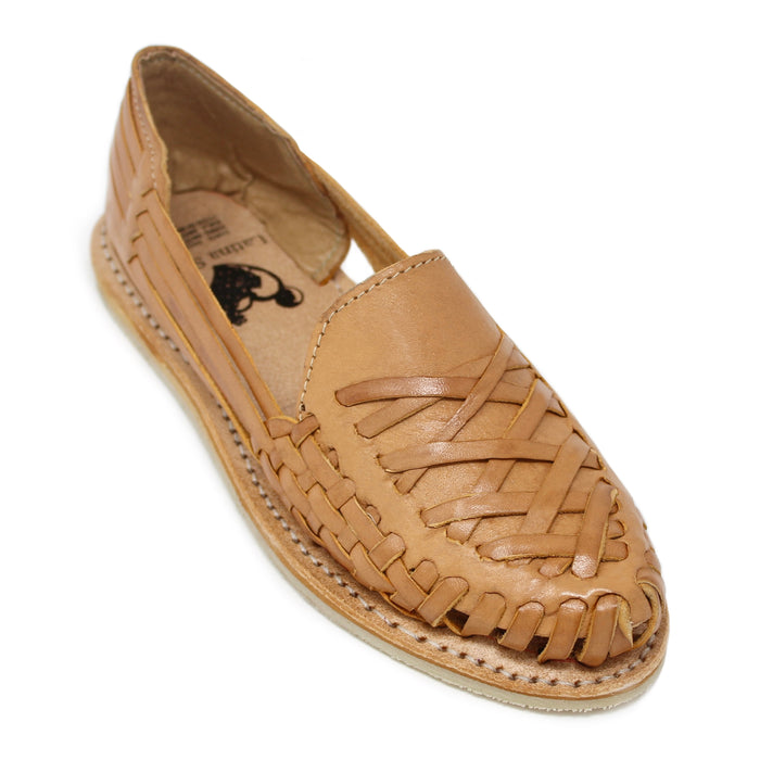 A natural leather slip-on Sandal with a woven braided pattern across the upper