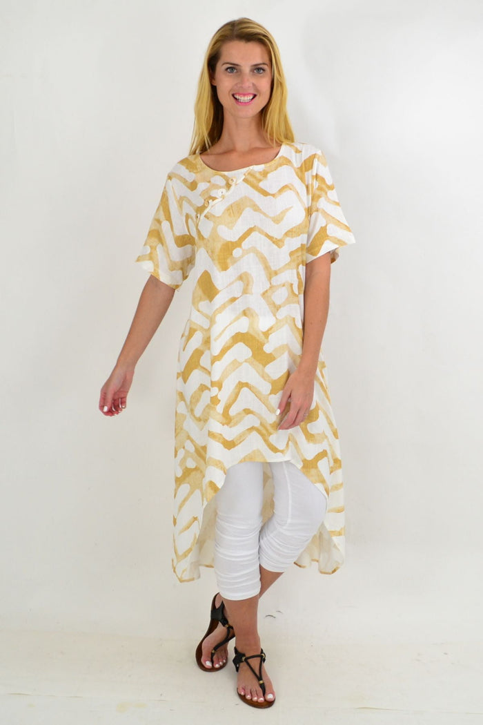 Beige and cream tribal print linen blend hi-low hem tunic by Ruby Rain, featuring a relaxed fit and intricate tribal pattern.