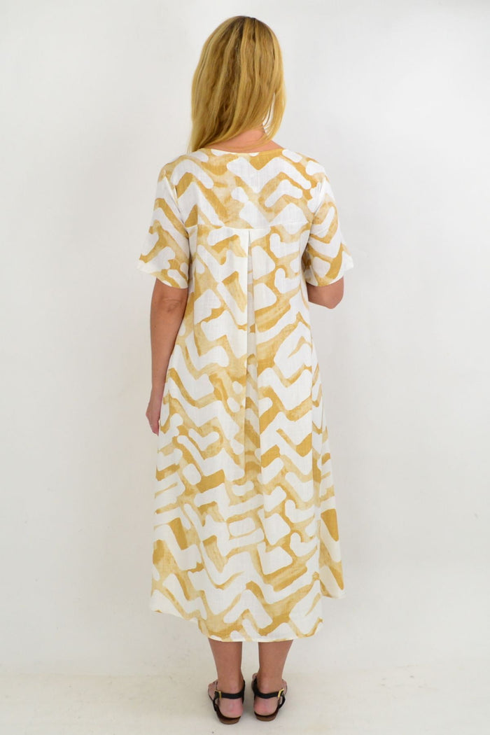 Beige and cream tribal print linen mix hi-low hem tunic by Ruby Rain, shown as a stylish, flowy women's tunic top.