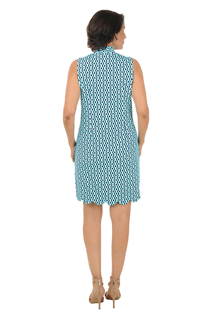 Woman wearing a blue patterned dress on a white background