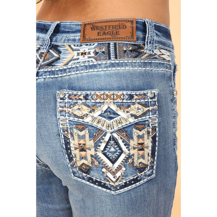Close-up of embroidered faux flap back pocket featuring faux leather, rhinestones, sequins, and western embroidery on Westfield Eagle jeans.