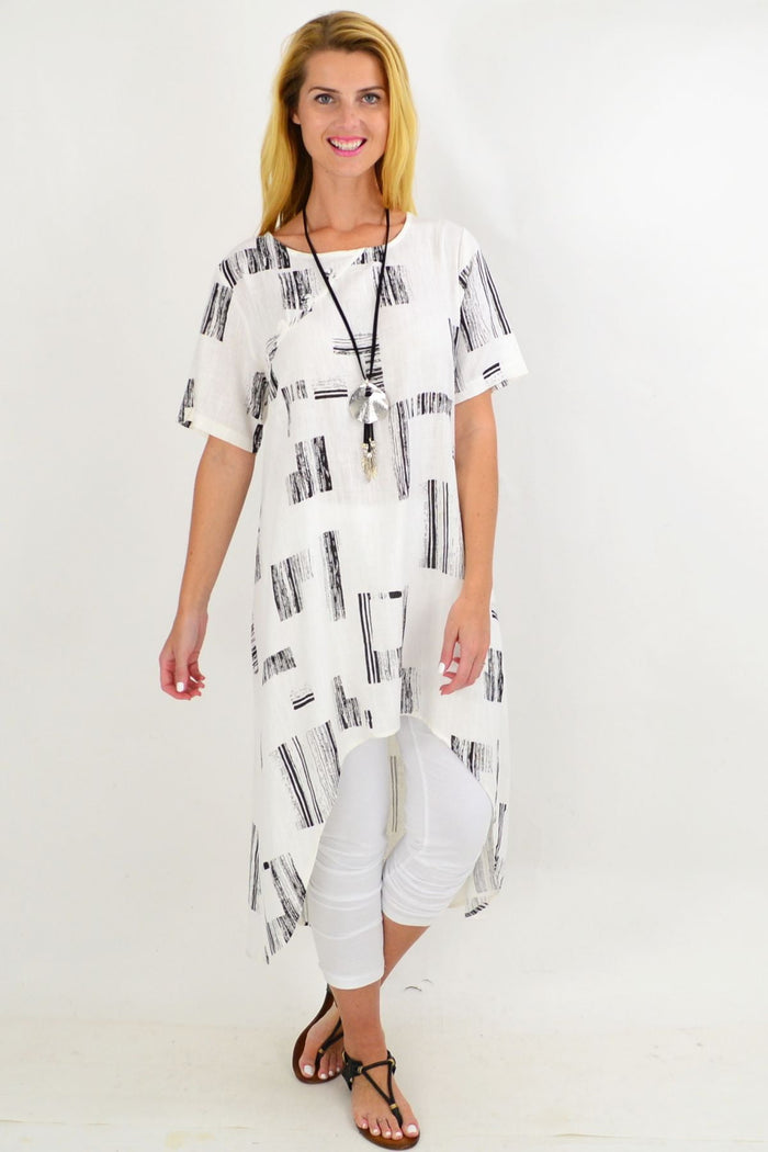 White pattern linen tunic with hi-low hem, featuring an asymmetrical design, by Ruby Rain.