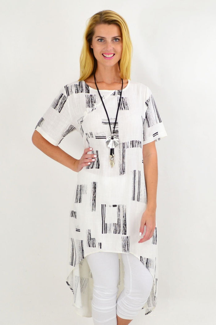White pattern linen tunic with hi-low hem from Ruby Rain, featuring an asymmetrical design and long silhouette.