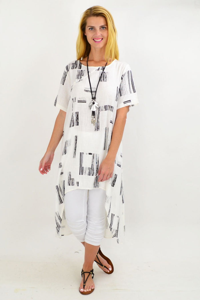 White pattern linen tunic with hi-low hem and asymmetrical design, perfect for casual wear by Ruby Rain.
